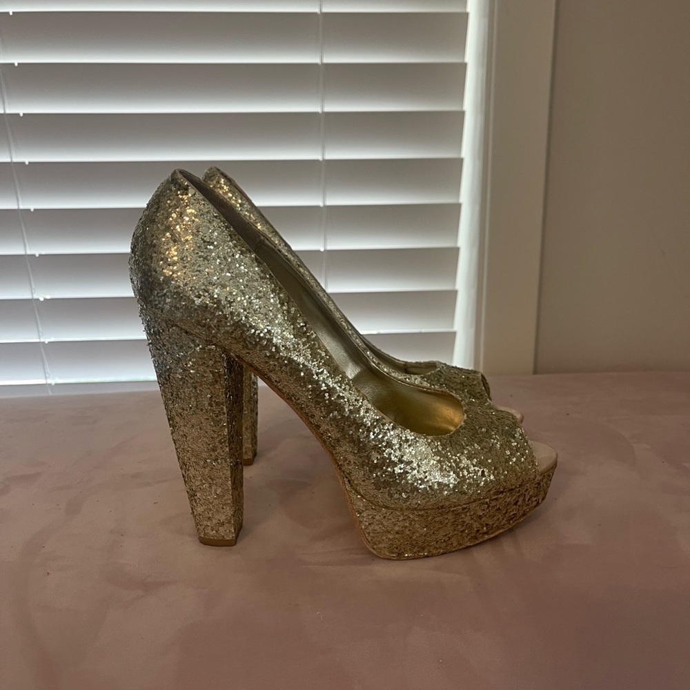 Glittered in Gold Platform Pumps by Steve Madden.
